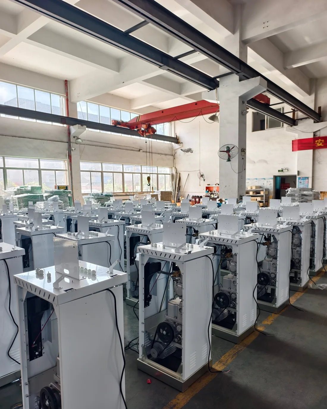 T-Series dispenser hydraulic units lined up for assembly