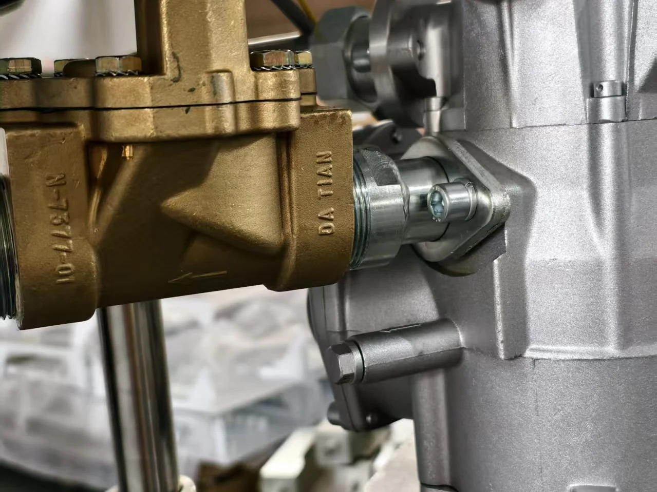 A DT- part number and the DATIAN name cast into the brass valve body of a high-flow dispenser