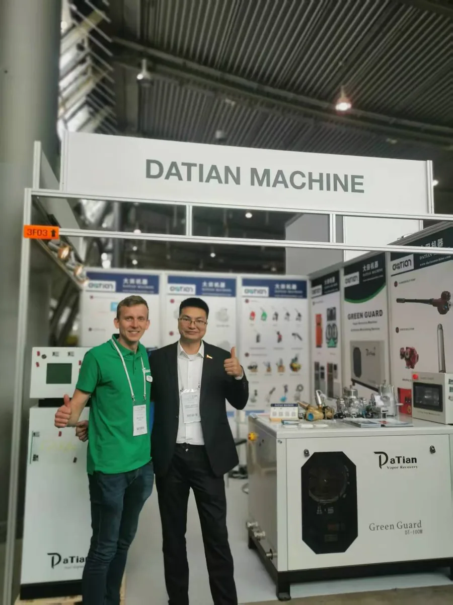 A customer with Datian staff beside the GreenGuard DT-100M at UNITI Expo 2024