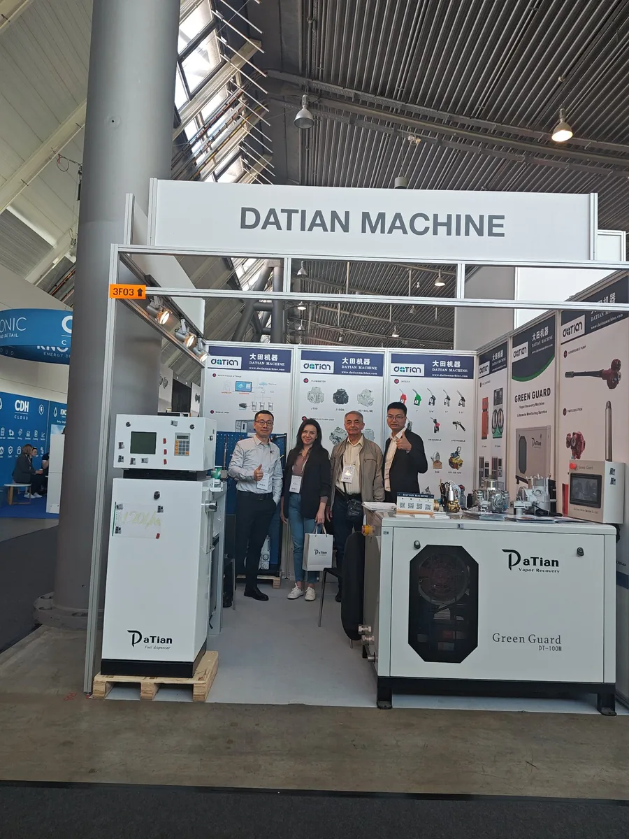 Marina Riznychenko of Technotrade LLC with Datian Machine staff inside booth 3F03 at UNITI Expo 2024