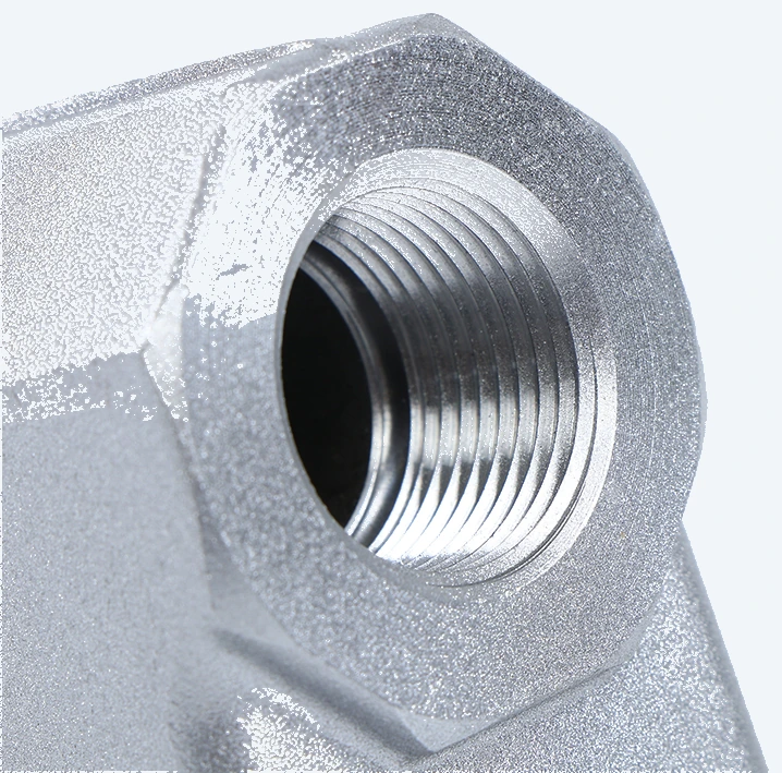 Type A composite hose connector with a 3/4 in NPT outlet, mounting face and hole pattern