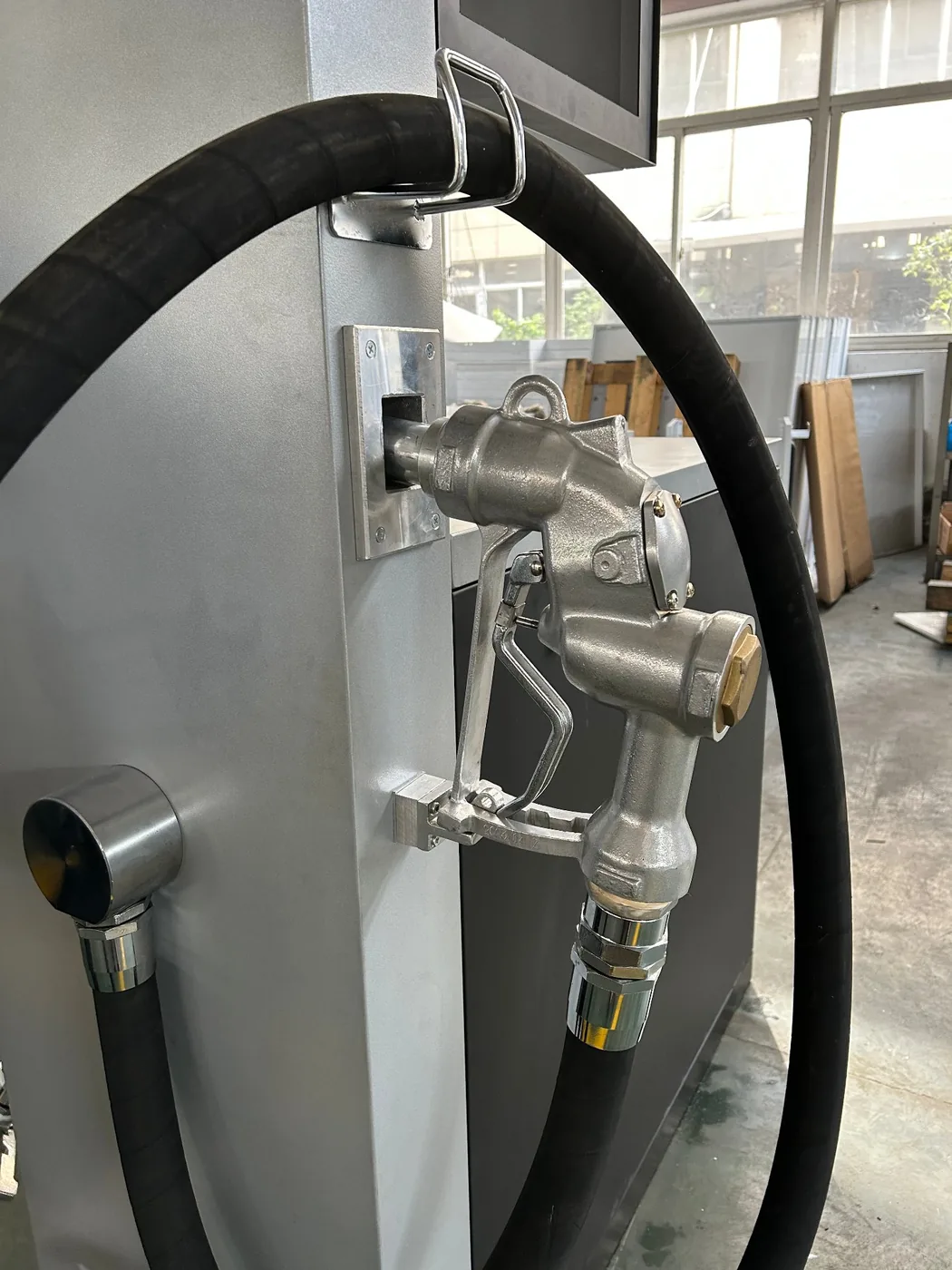 Heavy-duty refuelling nozzle hung on the side of the 200L dispenser
