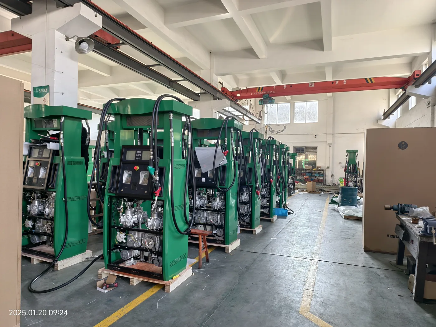 Row of green DT-G cabinets staged in the workshop, wider view