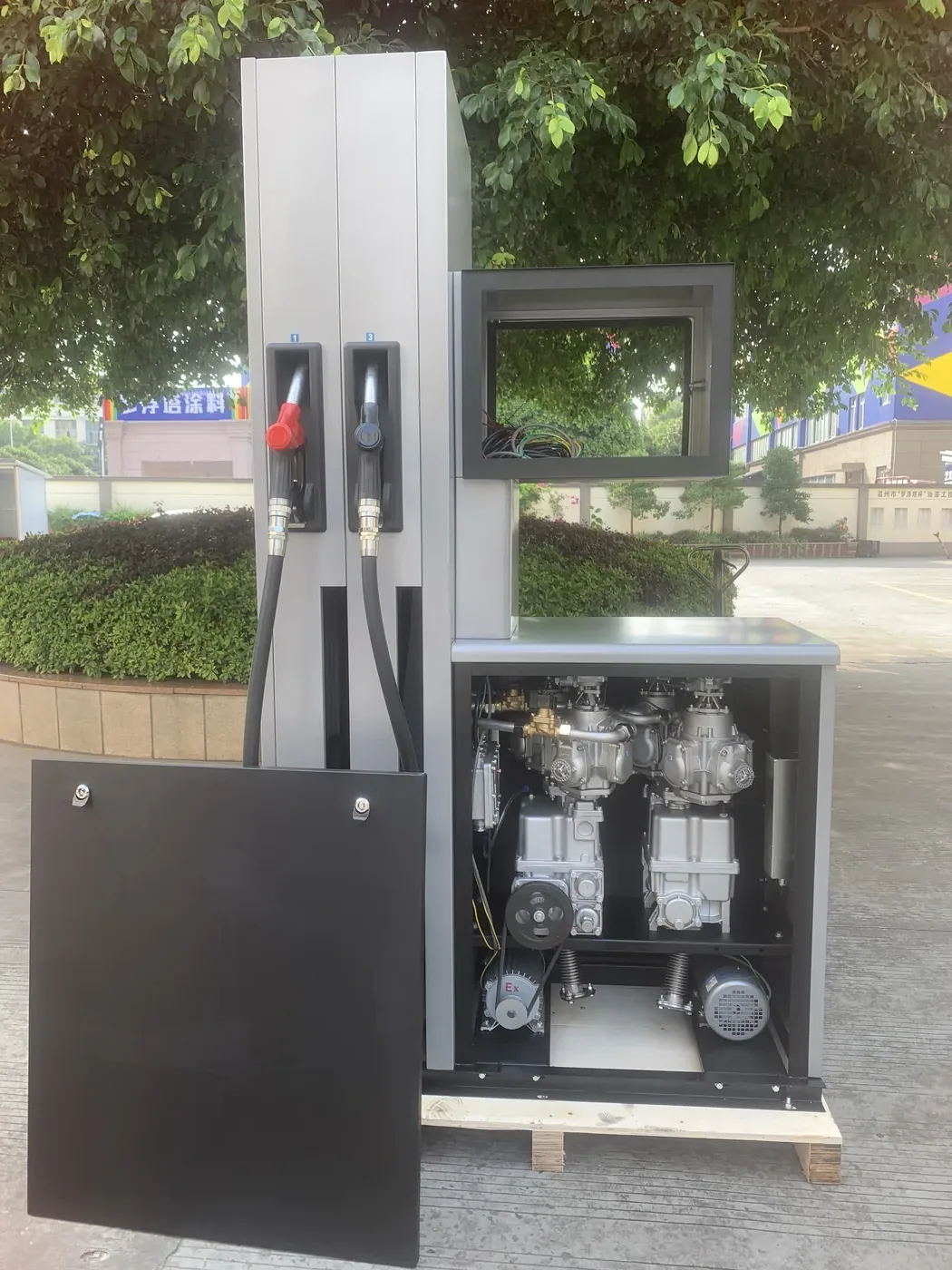 DT-L series two-nozzle dispenser with side panel open, showing pumps and motor