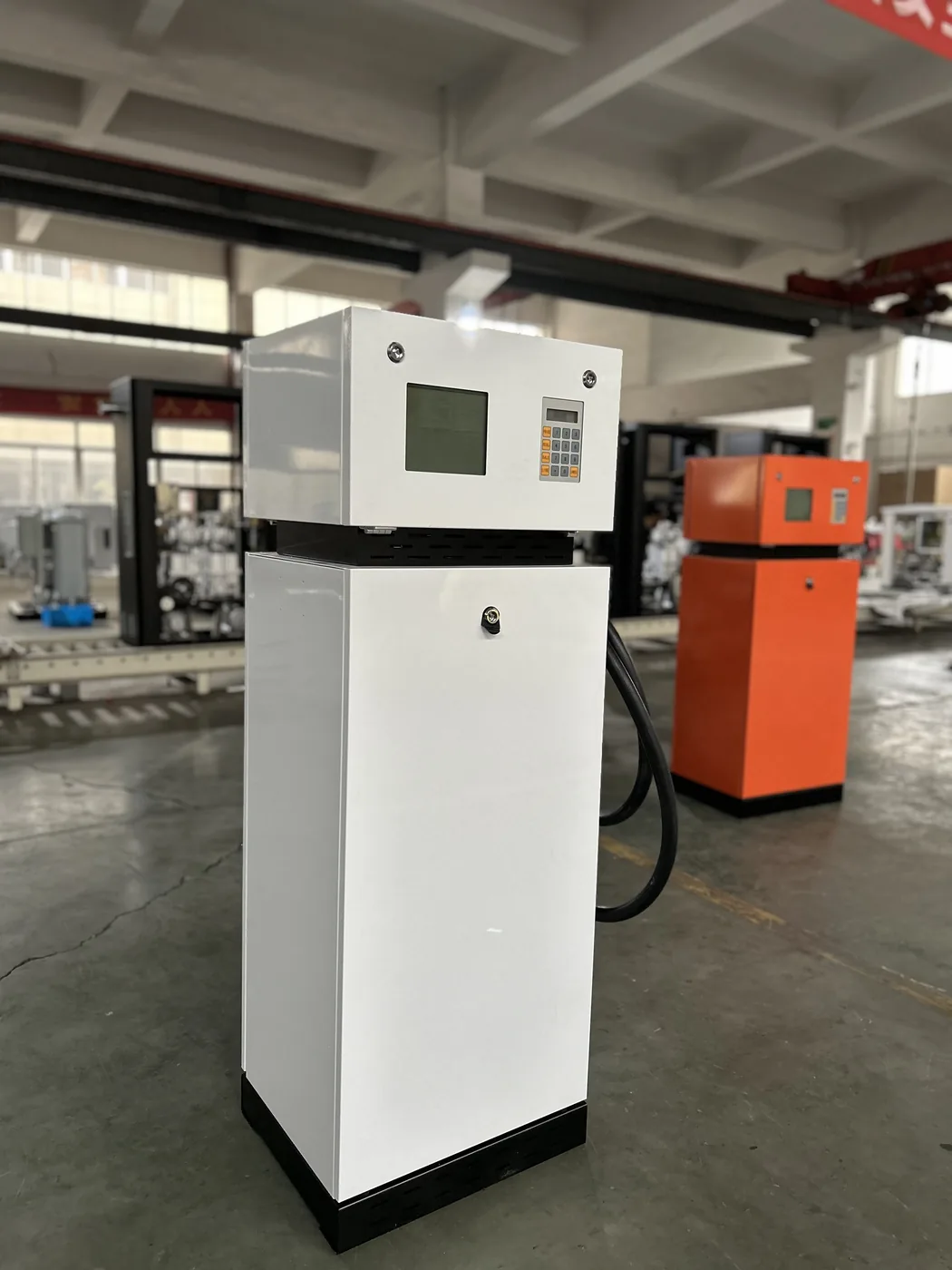 DT-T1 dispensers staged in the workshop, white and red cabinets side by side