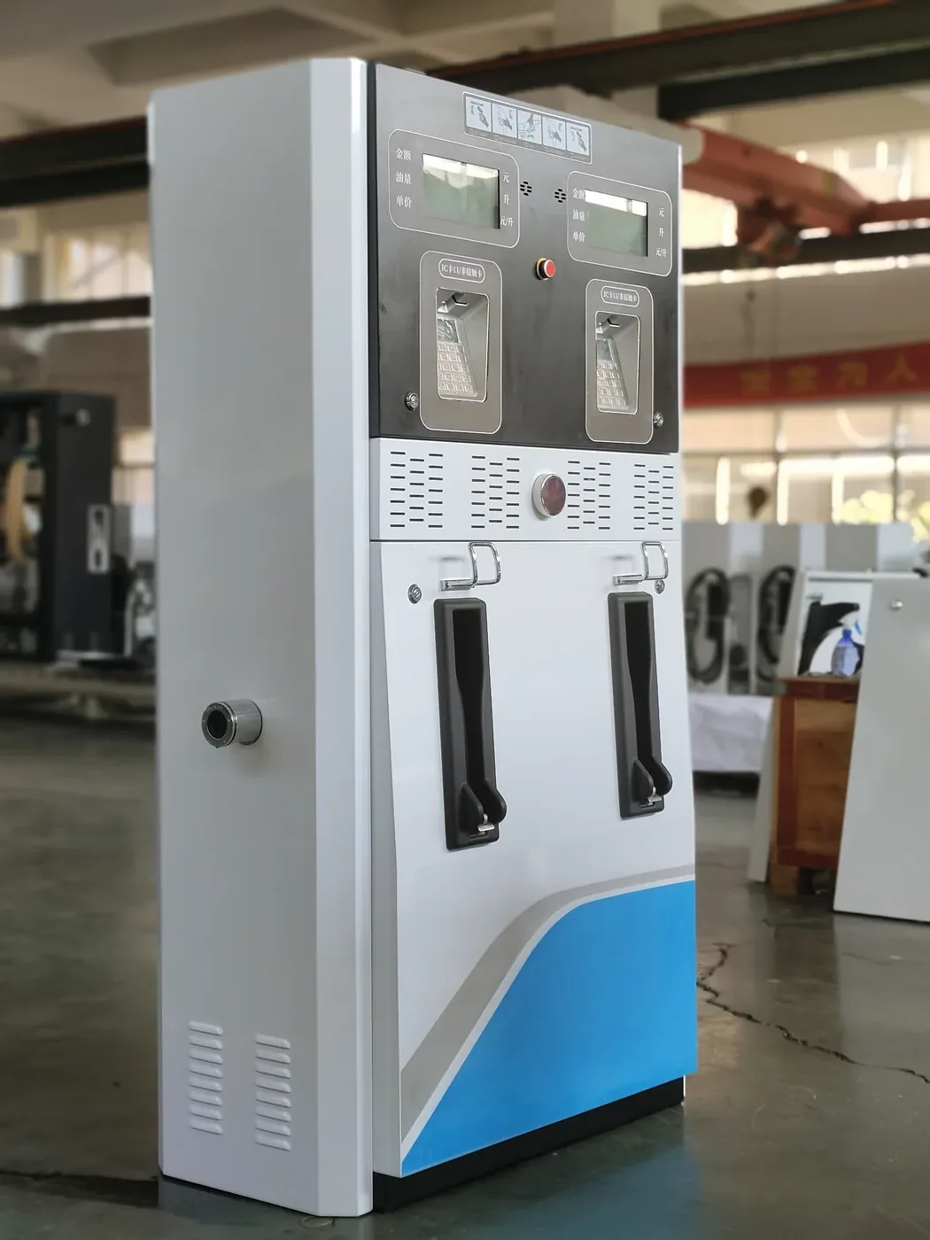 DT-T2 twin-nozzle dispenser, white cabinet with blue wave accent, workshop front view with cabinet doors closed