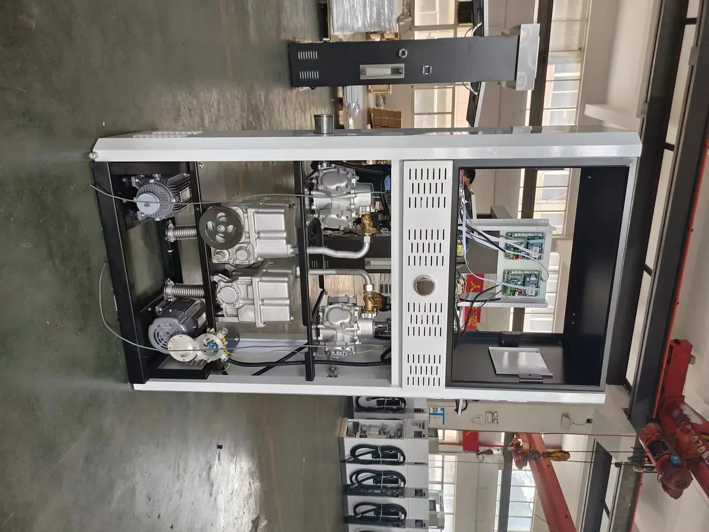 DT-T2 dispenser with open front panel, showing dual pump and motor assembly