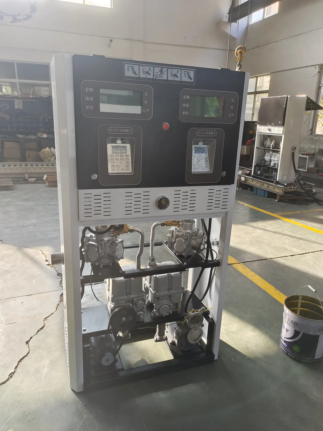 DT-T2 dispenser with open front panel, showing display modules and motor / pulser area